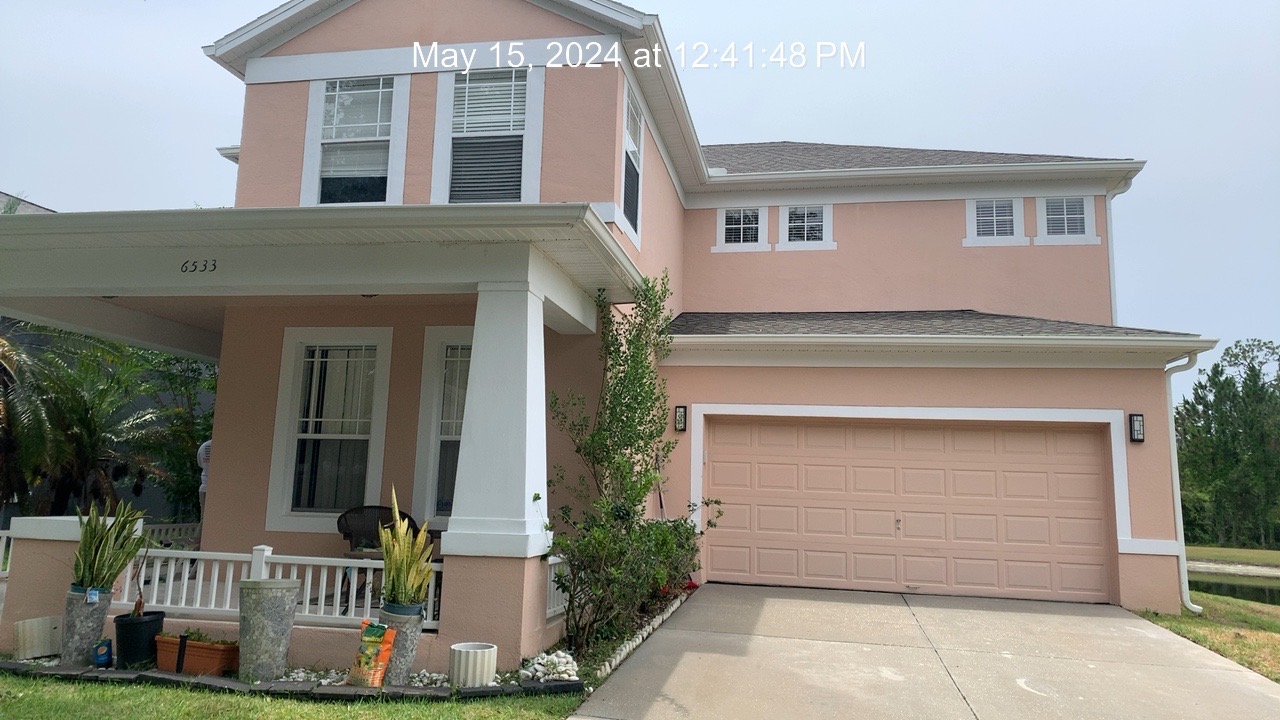 Exterior house wash and concrete cleaning in Windermere,Florida  Thumbnail